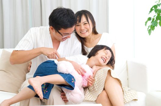 Indoor portrait of asian family