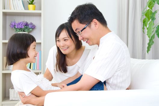 Asian family having fun at home