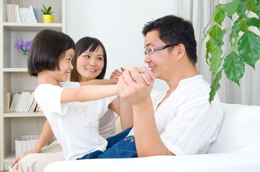 Asian family having fun at home