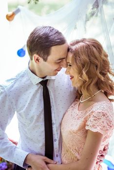 Close up portrait of couple. Smiling man and woman embracing in Lviv, Ukraine.