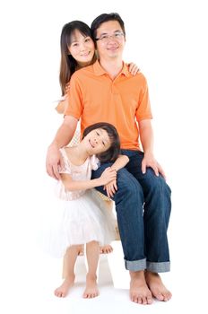 Indoor portrait of beautiful asian family