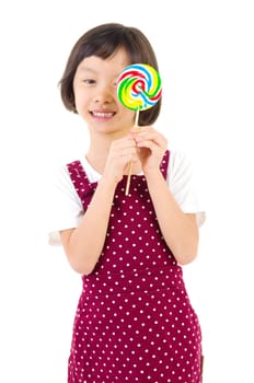 Little girl holding lollipop candy with smiling face