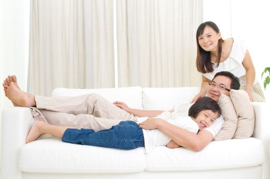 Indoor portrait of asian family