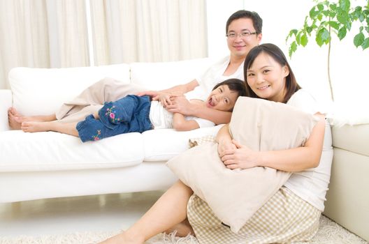 Indoor portrait of asian family
