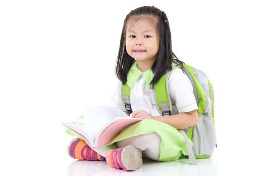 Happy little schoolgirl with books isolated on white background