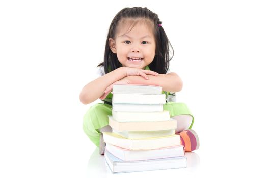 Happy little schoolgirl with books isolated on white background