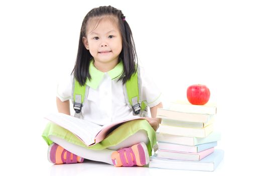 Happy little schoolgirl with books , isolated on white background