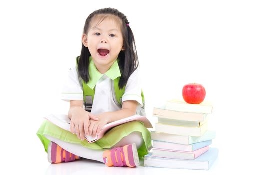 Happy little schoolgirl with books , isolated on white background