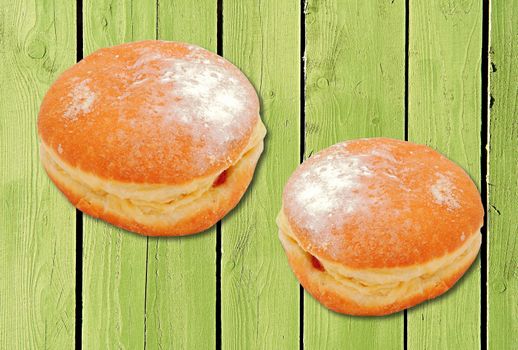 Two donuts with strawberry jam filling.