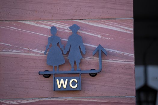 Sign WC with stylized man and woman