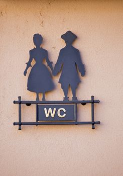 Sign WC with stylized man and woman