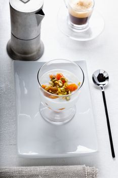 Homemade yogurt with dried apricots and coffee