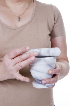 Granite mortar and pestle in female hands