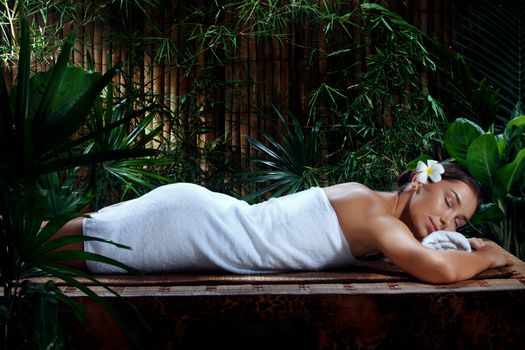portrait of young beautiful woman in spa environment.