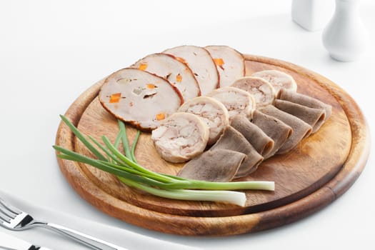 Close up view of cold boiled sliced meat stuff on white