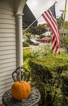 Big orange autumn pumpkin on a garden table