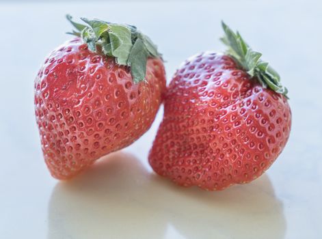 Close up of fresh strawberries on white background