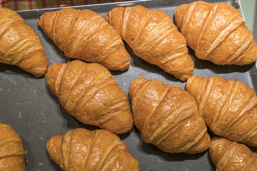 Croissants on a black background from above