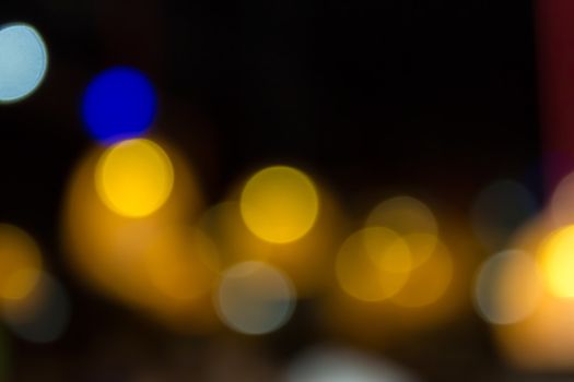 abstract background of blurred warm 
lights with cool blue spots with bokeh effect