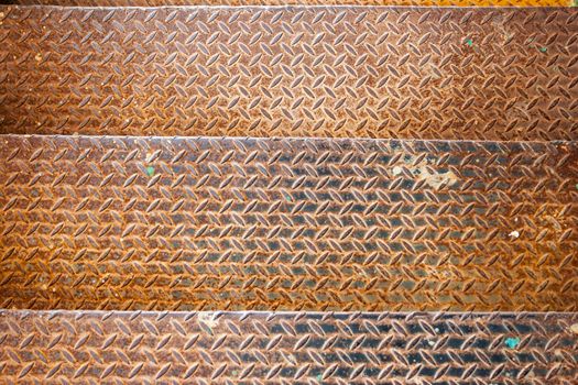 three metal textured rusty yellow old stage