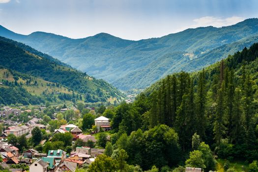 view of little town from the top between mountains in the summer