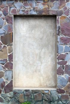 frame in the wall is made of pieces of stone