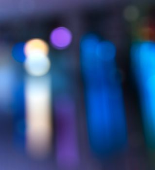 abstract evning blue background of blurred cool lights with cool violet spot with bokeh effect