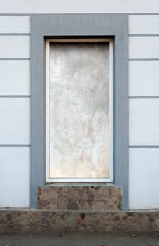 Frame of desolate immured new door with steps of cut stone
