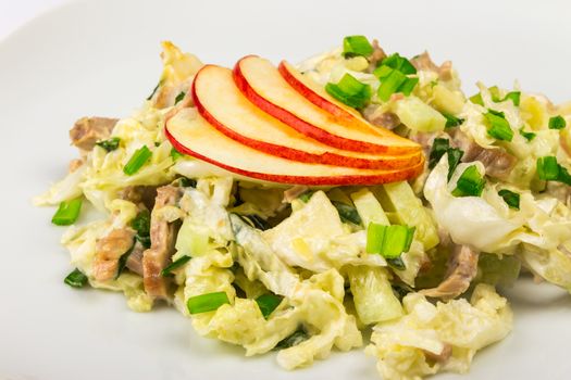 meat salad with cabbage, cucumbers and apples