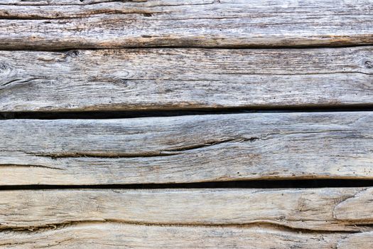 embossed texture of very old and wrinkled wooden planks