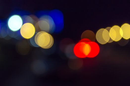 abstract blur of red and blue street lights at night