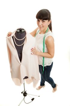 the woman the tailor about a mannequin on a white background
