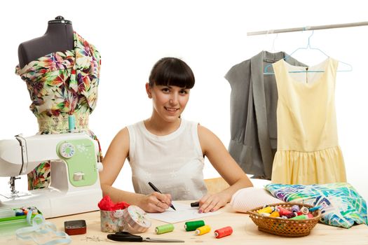 the woman the tailor does a pattern for clothes