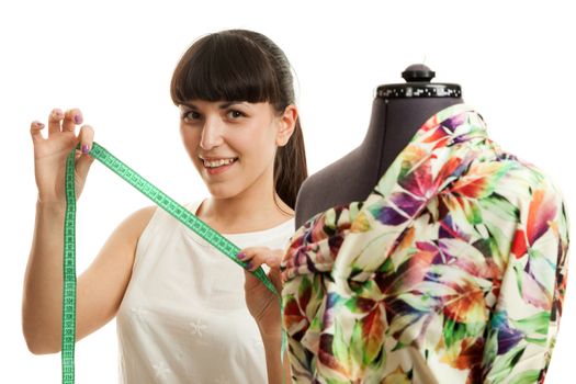 the woman the tailor about a mannequin on a white background
