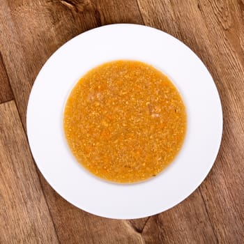 Vegetarian vegetable soup on a wooden table