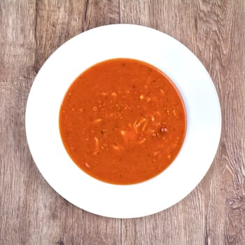 Vegetarian vegetable soup on a wooden table