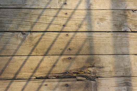 old cracked and weathered planks nailed