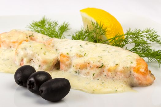 grilled fillet of red salmon, under French cream sauce, with Provencal herbs, filed with parsley lemon and three black olives