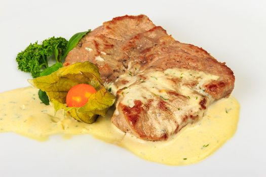 big and juicy piece of Bavarian roasted pork in a classic, authentic beer, white sauce. served with parsley and fezalis