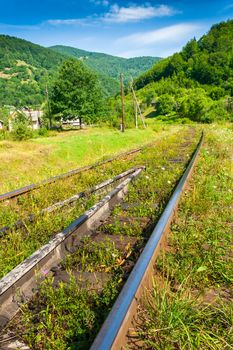 Old railway sneaking through mountain near the populated area