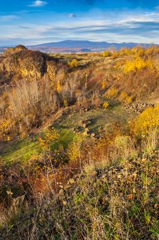 autumn landscape. the view from the high hill to the valley and the mountains far away. horizontal