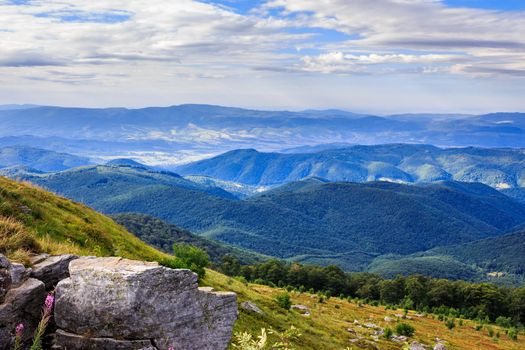 panorama of mountains and rocky ledge on the hillside. horizontal