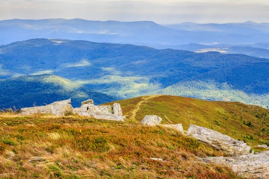 footpath at the top of the hill leading into the mountains behind stones