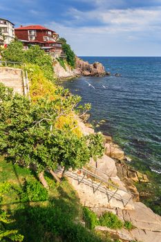 steps to the rocky shore from the old town before the storm