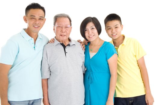 Indoor portrait of beautiful asian 3 generations family over white background