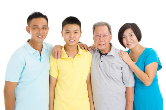 Indoor portrait of beautiful asian 3 generations family over white background