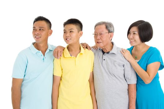 Indoor portrait of beautiful asian 3 generations family over white background