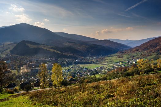 autumn landscape. view from the hill over the city in a mountain valley