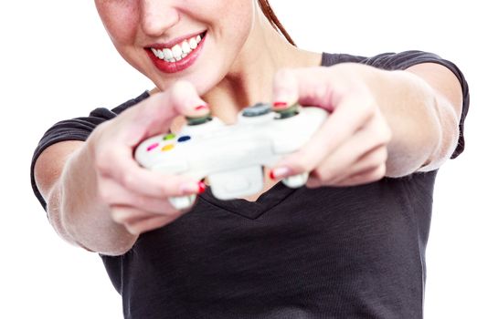 Young woman plays a videogame, isolated on white background