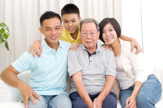 Indoor portrait of beautiful asian 3 generations family